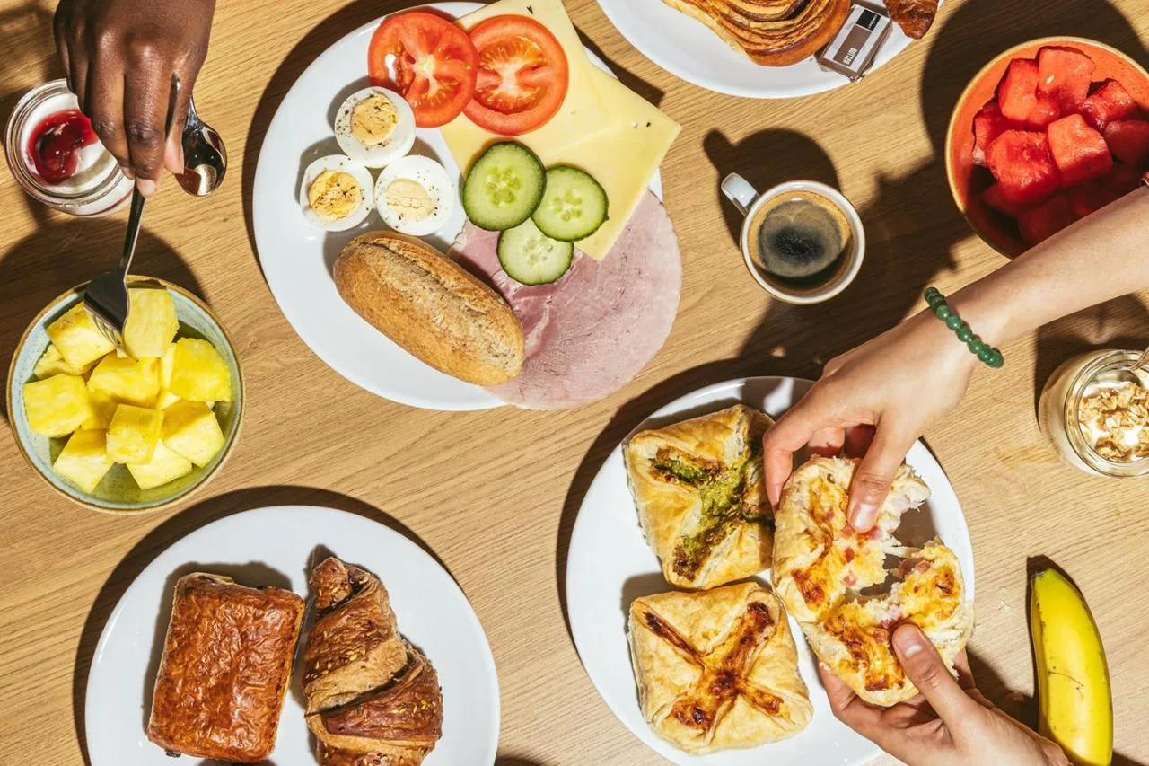 Table with breakfast plates at Point A London Liverpool Street