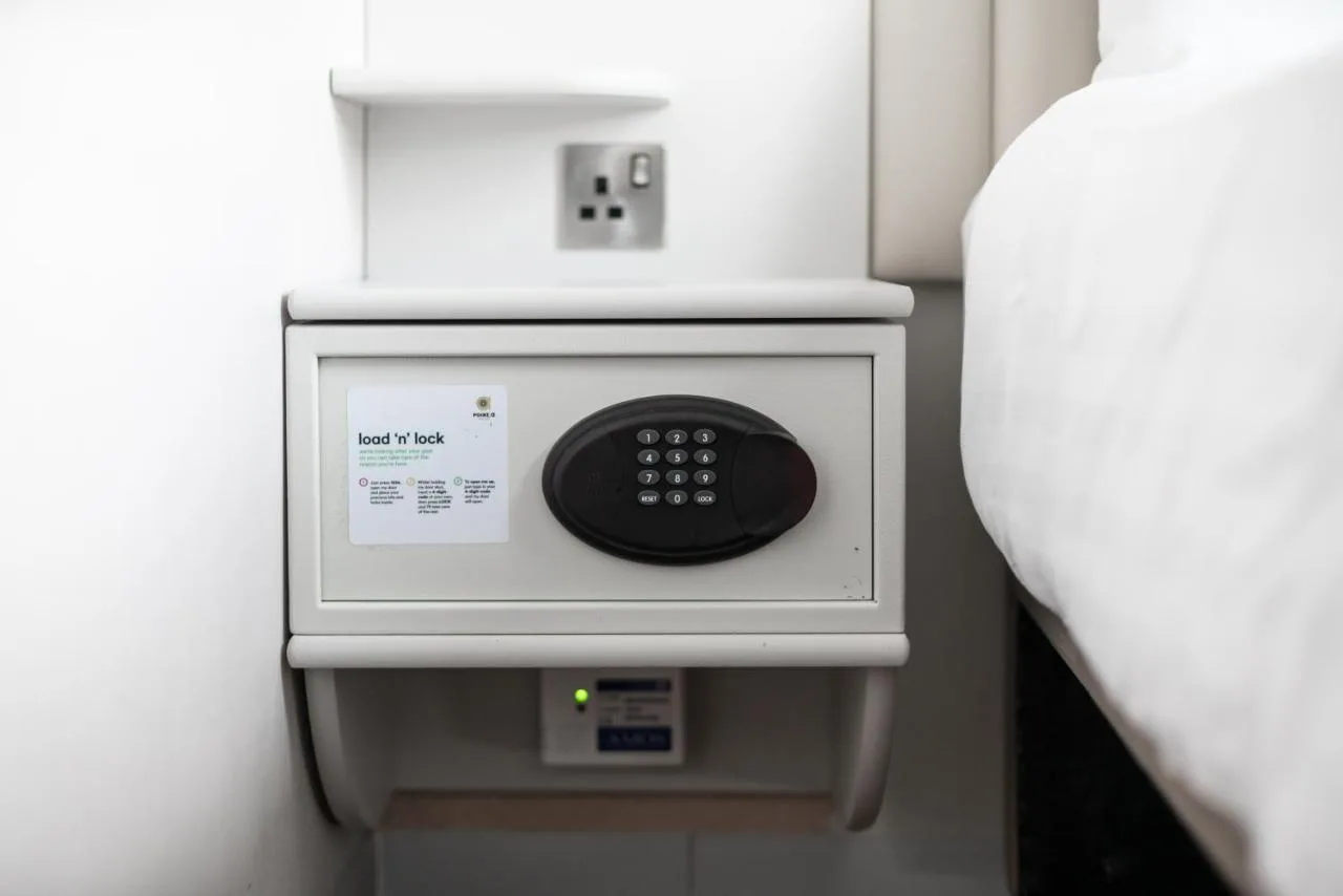 Guest room with wall-mounted remote control at Point A London Liverpool Street